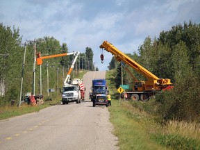 Hydro crews adjusted the overhead wires so that Kerr crane crews could pull a nine ton vehicle out of the ditch where it lay for over a week just north of Clute.