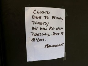 Sign on the door of Pure Country Grill and Pub in Frank, Ab, workplace of the victim of a suspected homicide and child abduction that occurred in nearby Blairmore, Ab., on Monday, September 14, 2015. Mike Drew/Calgary Sun/Postmedia Network