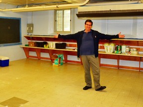 Barry Clarke, a community and family services worker at the Salvation Army Food Bank in Mitchell, revels in the new, bigger space for the organization in the basement of Upper Thames Missionary Church, on its opening day at the new location, Sept. 4. GALEN SIMMONS/MITCHELL ADVOCATE