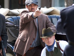 Kevin Wyville, left, and Dan Huggett prepare for a scene in a movie being shot in downtown Wallaceburg on James Street on Sunday afternoon. The movie highlights the life of gangster Red Ryan, who was killed following a bank robbery in Sarnia in 1936. Filming for the movie also took place in Sarnia and Dresden.