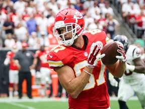Kansas City Chiefs tight end Travis Kelce catches a pass from quarterback Alex Smith to score his second touchdown in the first half of the NFL football game against the Houston Texans, Sunday, Sept. 13, 2015, in Houston. (Michael Minasi/Conroe Courier via AP)
