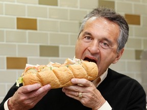 Subway co-founder Fred DeLuca poses in a Subway branch in central London, in this file photo taken January 26, 2012. DeLuca, who was also the CEO of Subway, died at 67 on Monday, the company reported Tuesday. REUTERS/Stefan Wermuth/Files