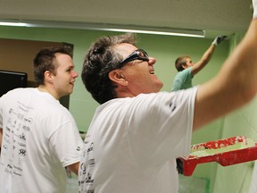 Imperial Oil employees Alexandre Leclerc, left, Paul Bourgeois and Travis Copeland, paint the soon-to-be boardroom at Lambton Elderly Outreach. They were among about 200 volunteers doing community work for seniors and not-for-profit agencies during this year's Day of Caring kick-off to the United Way of Sarnia-Lambton's annual capital campaign. (Tyler Kula, The Observer