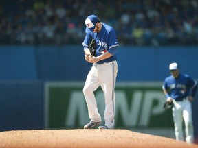 Toronto Blue Jays starting pitcher Drew Hutchison pauses on the mound before throwing against the New York Yankees at Rogers Centre in Toronto on August 16, 2015. (THE CANADIAN PRESS/Fred Thornhill)
