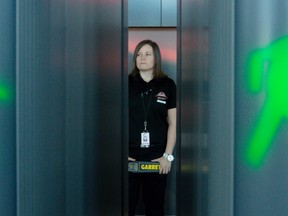 Kayla McCaffrey, an Event Security staffer at Canadian Tire Centre, is framed by entrance signals on one of the new magnometers that will be used for enhanced security at the building for all events.  Tuesday September 15, 2015. Errol McGihon/Ottawa Sun/Postmedia Network