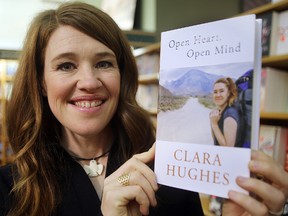 Olympic athlete Clara Hughes displays her new book "Open Heart, Open Mind" at McNally Robinson Booksellers in Winnipeg on Tuesday.
Brian Donogh/Winnipeg Sun