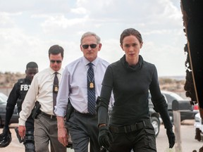This photo provided by Lionsgate shows, Daniel Kaluuya, from rear left,  as Reggie Wayne, Phil Coopers as Hank Rogerson, Victor Garber as Dave Jennings, and Emily Blunt, as Kate Macer, in a scene from the film, "Sicario." (Richard Foreman, Jr.  SMPSP/Lionsgate via AP)