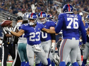 New York Giants running back Rashad Jennings (23) celebrates his touchdown against the Dallas Cowboys during the second half of an NFL football game Sunday, Sept. 13, 2015, in Arlington, Texas. (AP Photo/Tony Gutierrez)