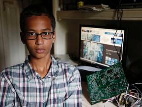 Irving MacArthur High School student Ahmed Mohamed, 14, poses for a photo at his home in Irving, Texas on Tuesday, Sept.  15, 2015. Mohamed was arrested and interrogated by Irving Police officers on Monday after bringing a homemade clock to school. Police don't believe the device is dangerous, but say it could be mistaken for a fake explosive. He was suspended from school for three days, but he has not been charged. (Vernon Bryant/The Dallas Morning News via AP)