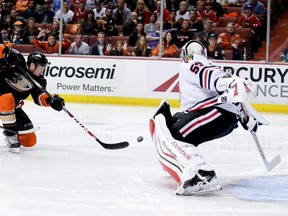 Ducks forward Matt Beleskey (left) scores the game-winning goal past Blackhawks goalie Corey Crawford during overtime in Game 5 of the Western Conference final in Anaheim, Calif., on May 25, 2015. Get ready to see plenty of three-on-three hockey during the NHL pre-season. (Alex Gallardo/AP Photo/Files)