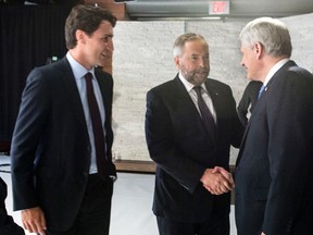 NDP leader Thomas Mulcair shakes hands with Conservative Party leader Stephen Harper as Liberal Party leader Justin Trudeau looks on prior to the first leaders' debate Thursday, August 6, 2015 in Toronto. The second debate with these three leaders will be held Thursday in Calgary. THE CANADIAN PRESS/Frank Gunn