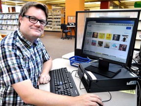 David McCord, the London Public Library’s co-ordinator of collections management, shows off hoopla September 15, 2015. Hoopla is a movie and music streaming service that will be available to library card holders September 21. CHRIS MONTANINI\LONDONER\POSTMEDIA NETWORK