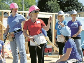 Sarah Hyatt/The Intelligencer 
Women from QuintEssential rolled up their sleeves for the Women's Build fundraiser for Habitat for Humanity this week. Here, they're shown working at a home on Golfdale Road, in Belleville.
