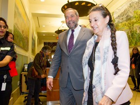 Federal NDP leader Thomas Mulcair and his wife Catherine Pinhas walk into a meeting with Calgary Mayor Naheed Nenshi at Old City Hall in downtown Calgary, Alta., on Wednesday, Sept. 16, 2015. The visit was part of a campaign stop in the city. Lyle Aspinall/Calgary Sun/Postmedia Network