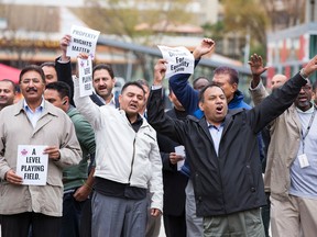 Cabbies protest at Edmonton city hall on Wednesday. (Ian Kucerak/Edmonton Sun)