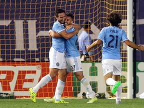 New York City FC midfielder Frank Lampard (left), R.J. Allen (27) and Andrea Pirlo celebrate Lampard's goal against Toronto FC on Wednesday night. (USA TODAY SPORTS)