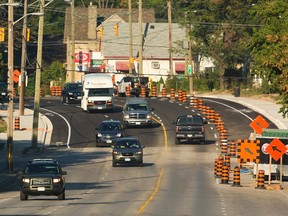 Riverside Road just west of Wharncliffe Road was reopened overnight allowing the morning rush hour traffic that has been overflowing on to Oxford and Springbank to resume their normal commutes in London, Ont. on Thursday September 17, 2015. 
Mike Hensen/The London Free Press/Postmedia Network