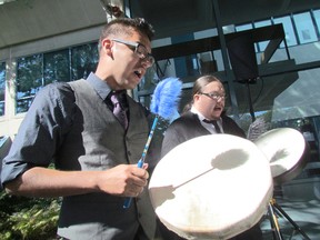 White-Lightning Clark, left, and William Cottrelle perform during a ceremony at Lambton College on Thursday September 17, 2015 in Sarnia, Ont. The college announced Shell Canada will contribute $240,000 over three years for programs to enhance opportunities for students. Paul Morden/Sarnia Observer/Postmedia Network