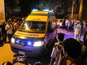 An ambulance carrying an Egyptian victim of Sunday's incident in which Egyptian forces mistakenly opened fire on tourists in the western desert, arrives at a morgue in Cairo, Egypt, Monday, Sept. 14, 2015. Egyptian forces hunting militants in the country's western desert mistakenly opened fire on Mexican tourists on safari, killing 12 people and dealing a further blow to the government's efforts to project an image of stability as it fights an increasingly powerful insurgency, officials said Monday.