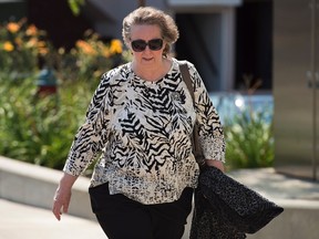 Maureen Adamson, Richard Oland's former secretary, heads to testify at the Dennis Oland trial in Saint John, N.B. on Wednesday, Sept. 16, 2015. Oland is charged with second degree murder in the death of his father. Richard Oland, 69, was found dead in his Saint John office on July 7, 2011. THE CANADIAN PRESS/Andrew Vaughan