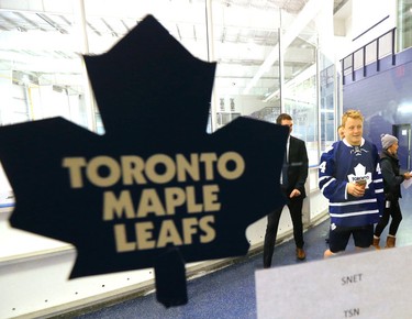 Leafs defence man Morgan Rielly cradles aTim Horton's before speaking to media at the opening of Toronto Maple Leafs training camp at the MasterCard Centre iin Toronto on Thursday September 17, 2015. Michael Peake/Toronto Sun/Postmedia Network