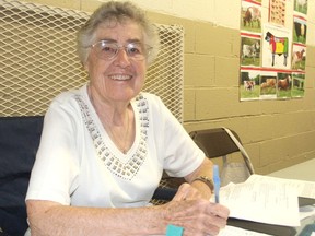 Joan Simpson mans a registration table for the homecraft competitions at the Kingston Fall Fair on Thursday. The 85-year-old is a 20-year volunteer at the annual fair. (Michael Lea/The Whig-Standard)