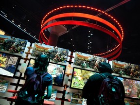 Gamers play Dragon Quest "Heroes" on the second day of the Electronic Entertainment Expo, known as E3 at the Convention Center in Los Angeles, California on June 17, 2015. (AFP PHOTO / MARK RALSTON)