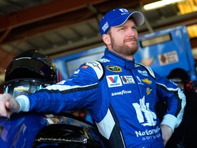 Dale Earnhardt Jr. stands in the garage area during practice for the NASCAR Sprint Cup Series Federated Auto Parts 400 at Richmond International Raceway on September 11, 2015 in Richmond, Va. (Robert Laberge/Getty Images/AFP)