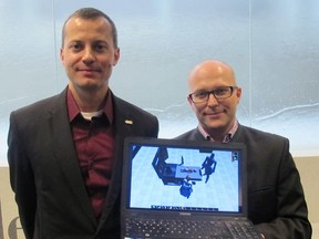 University of Alberta computing science professor Vadim Bulitko (left) and Royal Alexandra neonatal-perinatal care assistant professor Georg Schmolzer show off a new video game that will be used to aid neonatal resuscitation training in Edmonton. PHOTO SUPPLIED