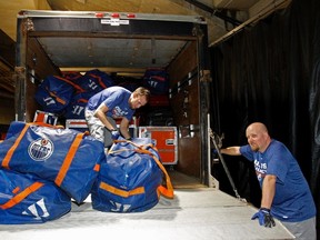 OIlers staff load a van with equipment for delivery to the arena in Leduc, where the team kicks off pre-season camp on Friday. (Tom Braid, Edmonton Sun)