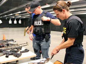 Angela Leaver, training unit instructor with the Smith Falls East Region Headquarters of the OPP, participates in the week-long firearms course at Kingston Police Headquarters on Thursday. (Steph Crosier/The Whig-Standard)