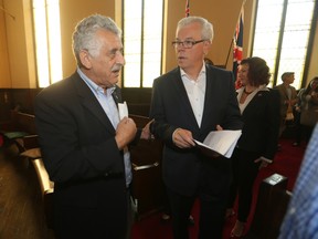 Manitoba Premier Greg Selinger (left) with Albert El Tessi, Thursday, Sept. 17, 2015. Selinger announced his wish to help Syrian refugees.