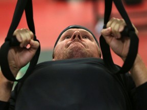 Ottawa Senators defenceman Mark Methot does some pullups during testing Thursday, Sept. 17, 2015 at Canadian Tire Centre.  Tony Caldwell/Ottawa Sun/Postmedia Network