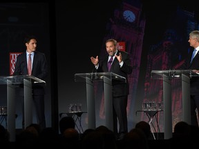 Liberal leader Justin Trudeau, left, NDP leader Tom Mulcair and Conservative leader Stephen Harper, right, take part in the Globe and Mail hosted leaders' debate Thursday, September 17, 2015  in Calgary.THE CANADIAN PRESS/Sean Kilpatrick