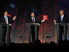 Liberal leader Justin Trudeau, left, NDP leader Tom Mulcair and Conservative leader Stephen Harper, right, take part in the Globe and Mail  leaders' debate Thursday, September 17, 2015  in Calgary.THE CANADIAN PRESS/Sean Kilpatrick