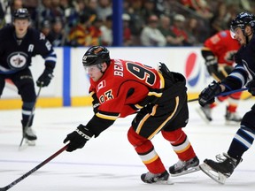 Calgary Flames' Sam Bennett gets held up by Winnipeg Jets' Morgan Klimchuk during third period NHL rookie action in Penticton, B.C., on Sept. 11, 2015. (THE CANADIAN PRESS/Jeff Bassett)