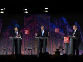 Liberal leader Justin Trudeau, left, NDP leader Tom Mulcair and Conservative leader Stephen Harper take part in the Globe and Mail hosted  leaders' debate as moderator David Walmsley looks on  Thursday, September 17, 2015  in Calgary.THE CANADIAN PRESS/Sean Kilpatrick