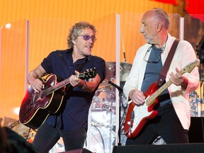 In this June 28, 2015 file photo, singer Roger Daltrey and Pete Townshed of the band The Who perform at the Glastonbury music festival at Worthy Farm, Glastonbury, England. The band postponed the rest of its North American tour on Friday. (FILE PHOTO)