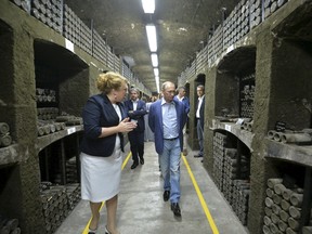 Russian President Vladimir Putin (R, front) visits a wine vault at the Massandra winery in Crimea, on Sept. 11, 2015. (REUTERS/Alexei Druzhinin/RIA Novosti/Kremlin)