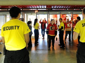 Calgary Flames fans pass through security check-points as they head into a game at the Scotiabank Saddledome in Calgary, Alta. on Thursday October 23, 2014. (Stuart Dryden/Calgary Sun/Postmedia Network)