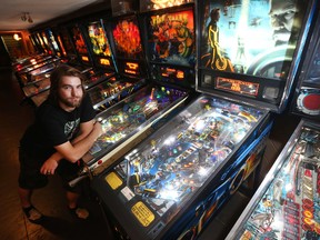 Josh MacKay stands beside one of many pinball machines at the House of Targ on Bank Street on Thursday Sept 17, 2015.  
Tony Caldwell/Ottawa Sun