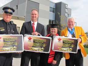 The OPP have new digital identification kits that will assist in finding missing children or seniors. The kits were donated by the Ontario Moose Association during the fraternity's annual convention in Chatham on Friday. From left: OPP Sgt. Dave Rektor; Sgt. Rob Geneja, OPP youth issues co-ordinator; and Ontario Moose Association members Norma Foley and Kelly Parker.