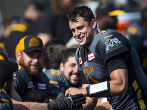 Hamilton Tiger-Cats quarterback Zach Collaros smiles with teammates as they play the Toronto Argonauts during the second half of their CFL football game in Hamilton, Ontario, Canada, September 7, 2015.    REUTERS/Mark Blinch