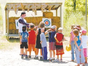 Campers at Stevenson Children?s Camp line up for archery lessons in the mid-2000s. The camp is celebrating its 65th year in 2015 and one of its major supporters, the Kinette Clubs of London, is marking its 75th year. The organizations have found ways to celebrate the milestones together. (London Free Press file photo)