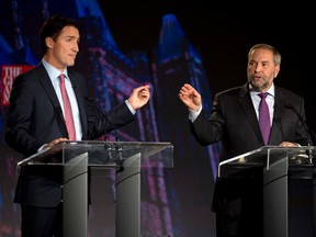 Liberal leader Justin Trudeau, left, debates NDP leader Tom Mulcair during the Globe and Mail  leaders' debate Thursday, September 17, 2015  in Calgary.THE CANADIAN PRESS/Jonathan Hayward
