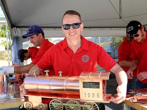 The Ontario Sheet Metal Apprenticeship Competition was held in Springer Market Square on Friday. A dozen apprenticeship workers had to make a copper model of the Engine 1905, Spirit of Sir John A., which is on display in Confederation Park. Ian MacAlpine/The Whig-Standard)