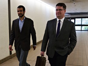 Omar Khadr, left, and his lawyer, Nathan Whitling, leave the court house in Edmonton onSept. 18, 2015. (Codie McLachlan/Edmonton Sun/Postmedia Network)