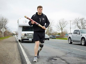 Captain Simon Mailloux carries the last Canadian Flag to fly at International Security Assistance Force Headquarters in Kabul, Afghanistan in a specially built baton during day one of the Soldier On Afghanistan Relay. Mailloux lost his leg on November 16, 2007 during an IED incident in Afghanistan In November 2009, Mailloux become the first Canadian amputee to redeployed to a war zone as a combatant. Canadians and runs from May 4 -9th from Trenton to Ottawa Ont. The flag will arrive on Parliament Hill on the National Day of Honour on May 9th and be presented to the Prime Minister of Canada.  Photo Supplied/Soldier On Canada