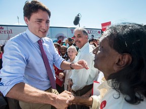 Liberal Leader Justin Trudeau greets supporters during a campaign stop on Friday, Sept. 18, 2015, in Montreal. THE CANADIAN PRESS/Paul Chiasson