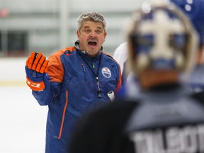 Edmonton head coach Todd McLellan (left) speaks with goaltender Cam Talbot (right) during Edmonton Oilers Training Camp in Leduc, Alta. on Friday September 18, 2015. Ian Kucerak/Edmonton Sun/Postmedia Network